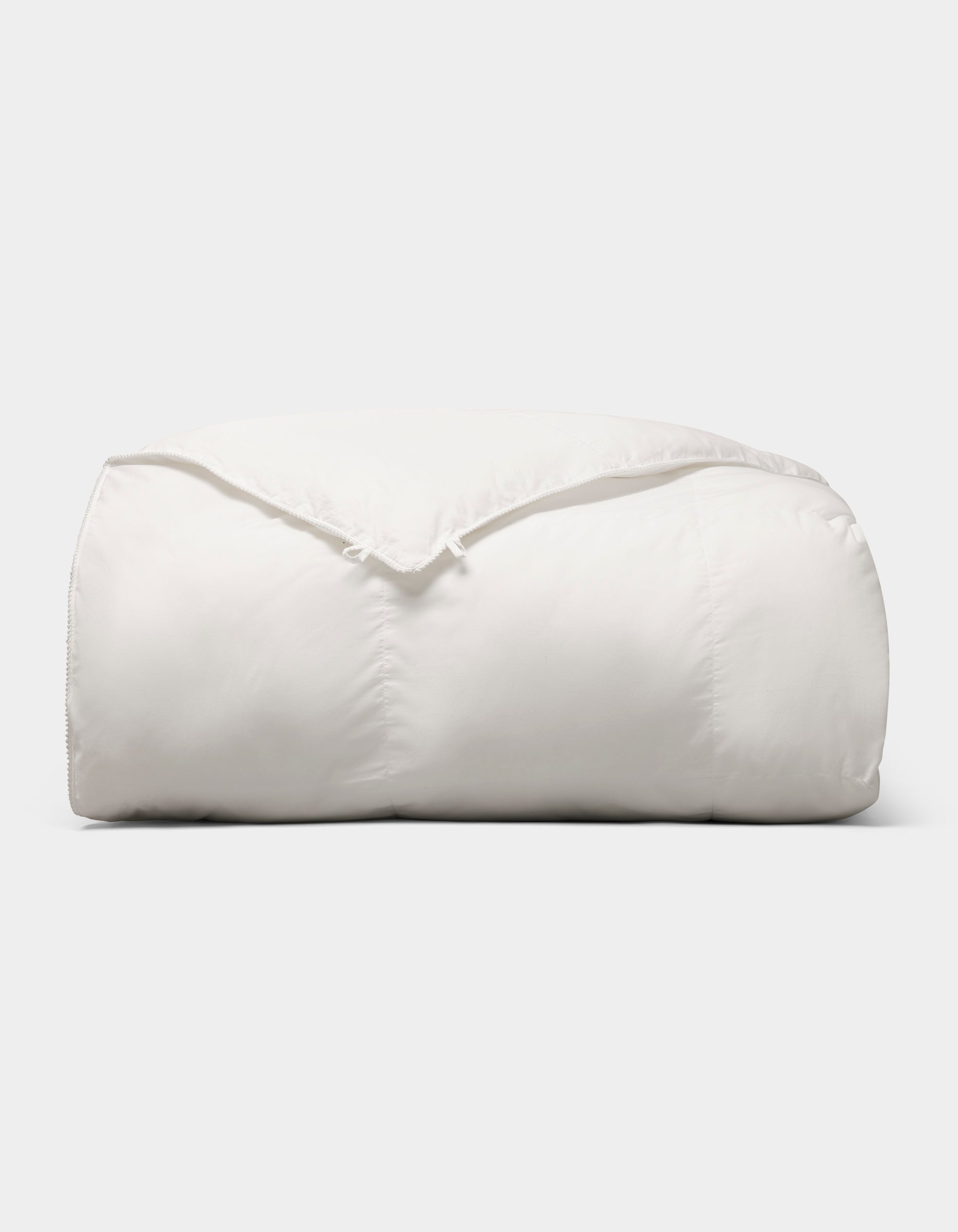 Down alternative comforter to be paired with Dove Grey, Charcoal, Creme, Driftwood, Light Grey, Oat, Pacific Blue, Shore, Peony, Walnut, Laurel, Classic Stripe in Pacific, Classic Stripe in Ebony, Classic Stripe in Laurel, White, Baja Stripe in Laurel, Baja Stripe in Maple, Mulberry, River duvet cover.